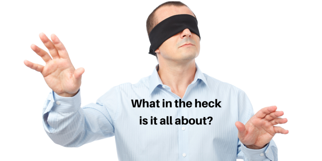 Man wearing a blindfold asking what is it all about?