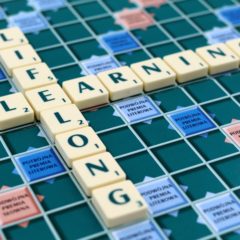 Scrabble game pieces spelling the phrase lifelong learning